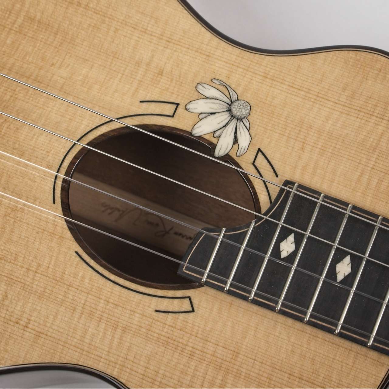 Makore and Lutz Spruce Tenor with Daisy inlay.