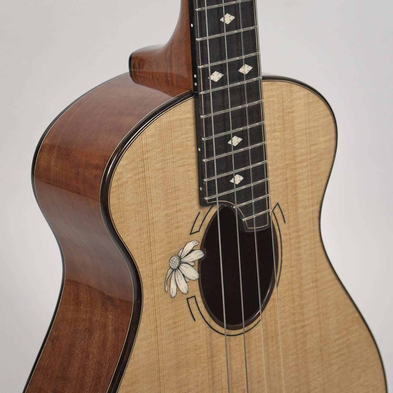 Makore and Lutz Spruce Tenor with Daisy inlay.